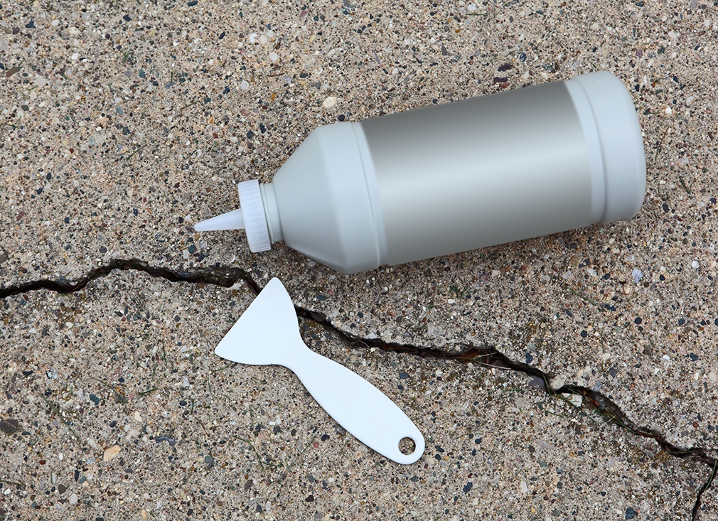 Repair cracks in your driveway before winter sets in. Not only does this help prevent tripping, but it also keeps water from seeping below the slaps and pushing them out of place when it freezes and expands.